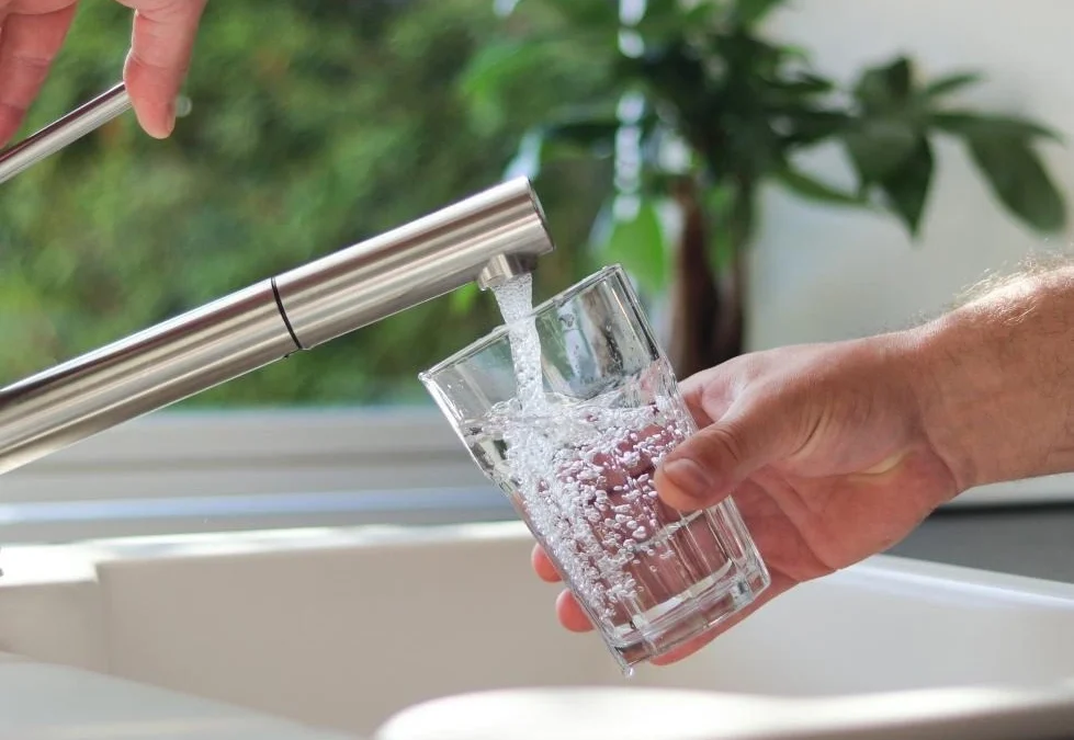 Technician installing water softener unit during Water Softener Replacement to avoid common mistakes